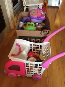Box of toys/books and grocery cart full of toy food