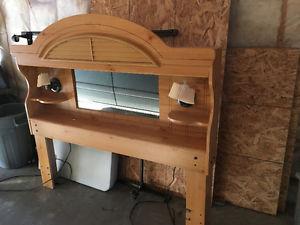 Matching head board and dresser with attached mirror