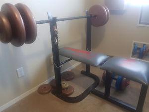 Old weight bench and dumb bells