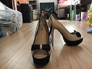 Size 8 black and beige high heels