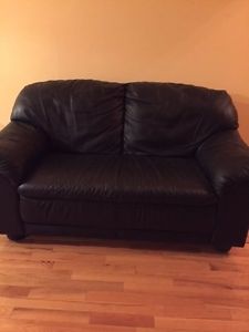 Two black leather love seats for sale