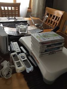 Wii Console with Wii fit board and various games