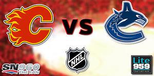 2 tickets Flames vs Vancouver Canucks Sat Jan 7th PL 2 row