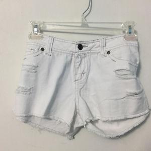 Distressed white jean shorts