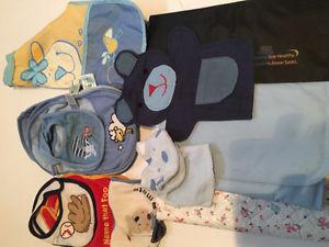 Baby bibs, change pads and puppets