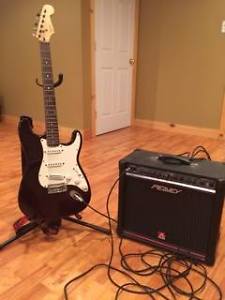 Selling Squier Stratocaster by fender - with Peavey amp.