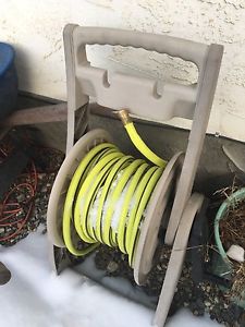 Hose reel with 100 foot hose.