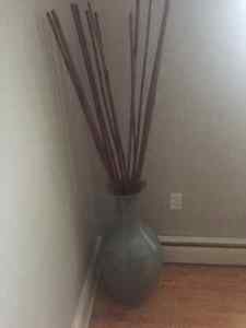 Large pottery vase with wood sticks