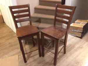 Two used wooden bar stools