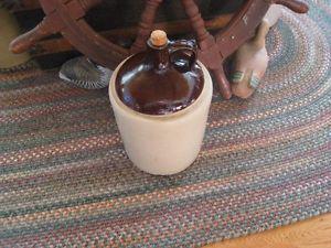 Vintage crock whiskey jug