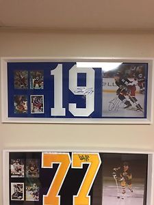 2 NHL Autographed jersey numbers in 12x28 frames