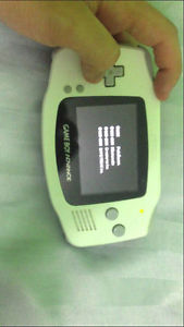 White gameboy advance with 2 games