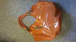 Brand new D&G handbag. Orange in color. $10