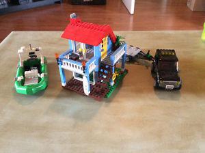 Lego beach house, jeep with trailer, speed boat