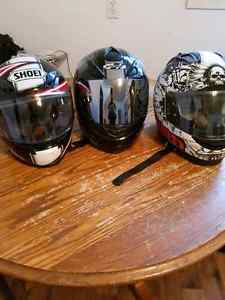 3 motorcycle helmets.