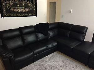 Black leather sectional + automan