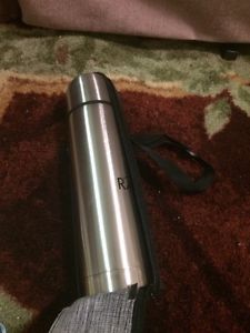 Small thermos in travel case