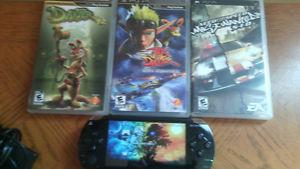 selling sony playstation portable.  four games/wcharger