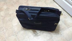Suitcase 15 inches high by 22 inches wide very good