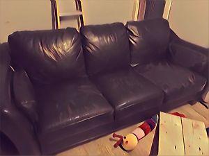 Leather couch worn.