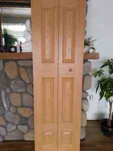 Five brown bi-fold closet doors