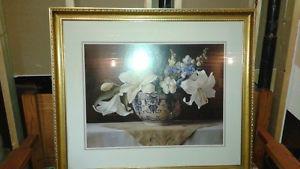 Large floral picture in gold frame.
