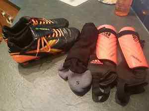 Like new men's size 7 soccer shoes, shin pads and socks
