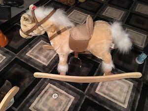 Noise making rocking horse