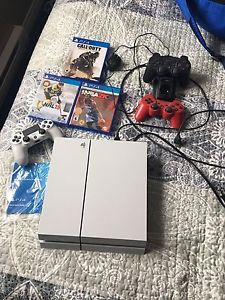 PS4 with controller and games AND 2 PS3 controllers