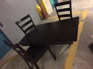 A very good condition dinning table with leather seats