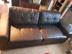 Brown faux leather sofa