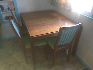 Table with leaf and 4 chairs