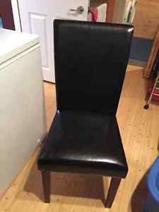Two black and brown dining chairs