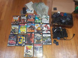 2 Playstation 2 consoles with various games