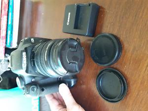Canon T1I with  mm lens, battery clip, 3 batteries