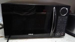 Lightly Used RCA Microwave $50 obo, can deliver
