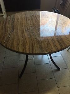 Selling marble table have few marks but it's good paid 