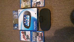 Like new Ps vita in box and 4 games