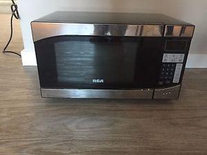 Almost new microwave paid $100
