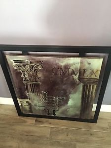 Large black framed in wall picture
