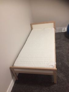 Wooden toddler bed with mattress
