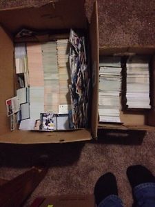 Box with over  hockey baseball and basketball cards