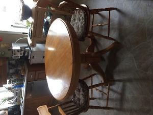 Oak round table and 4 chairs.