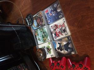 PS3 with games and controllers