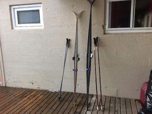Men's and women's skis with poles