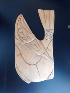 Salmon carved into wood