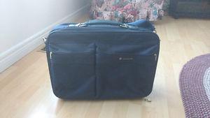 Suitcase 15 inches high by 22 inches wide very good