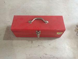 Red steel tool box with tools