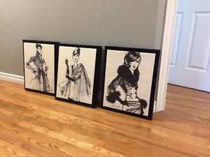 Three black and white canvases framed