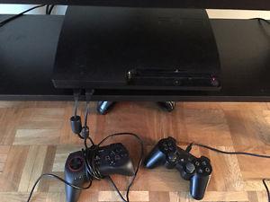 Playstation 3 with two controllers and AV adapter